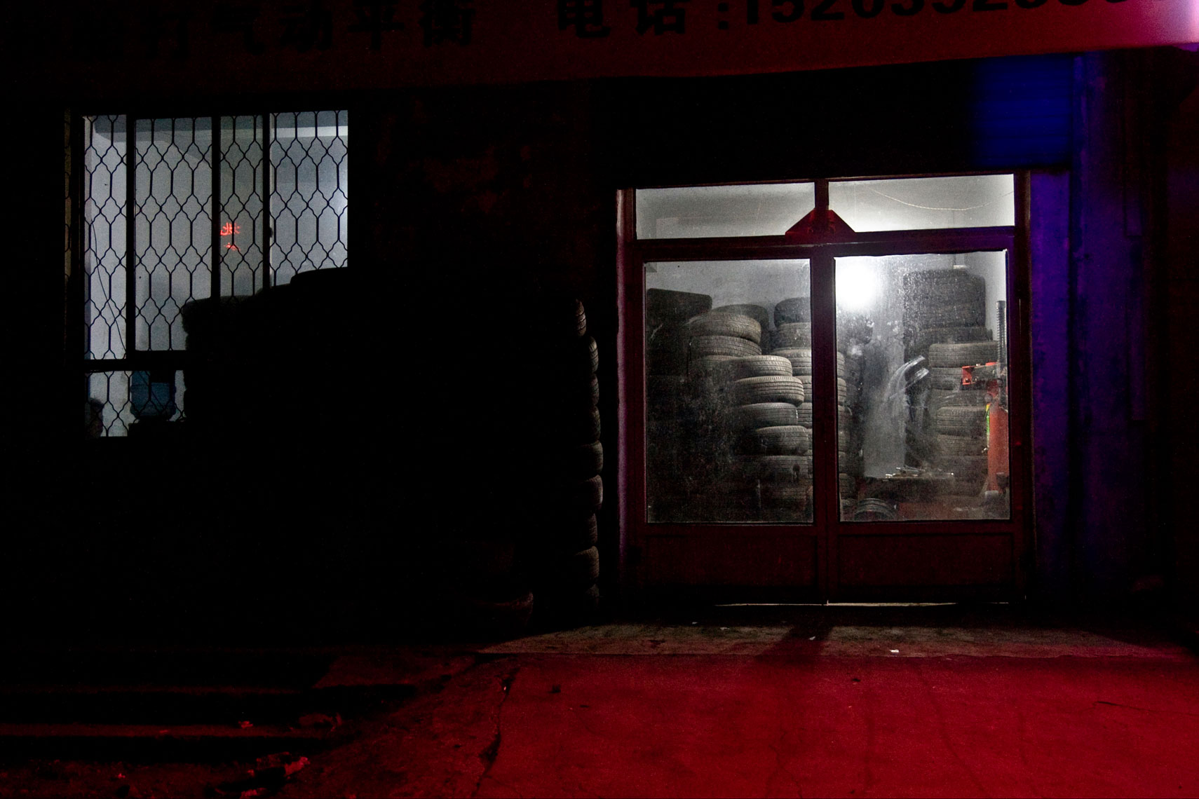 CHINA. Datong, Shanxi Province, September 2012. A tire shop.